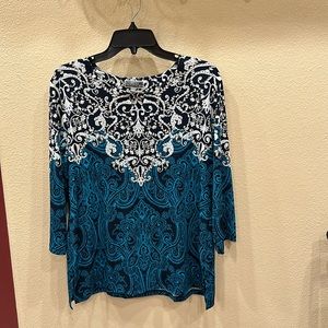 Blue, teal, and white blouse with silver rhinestones.
